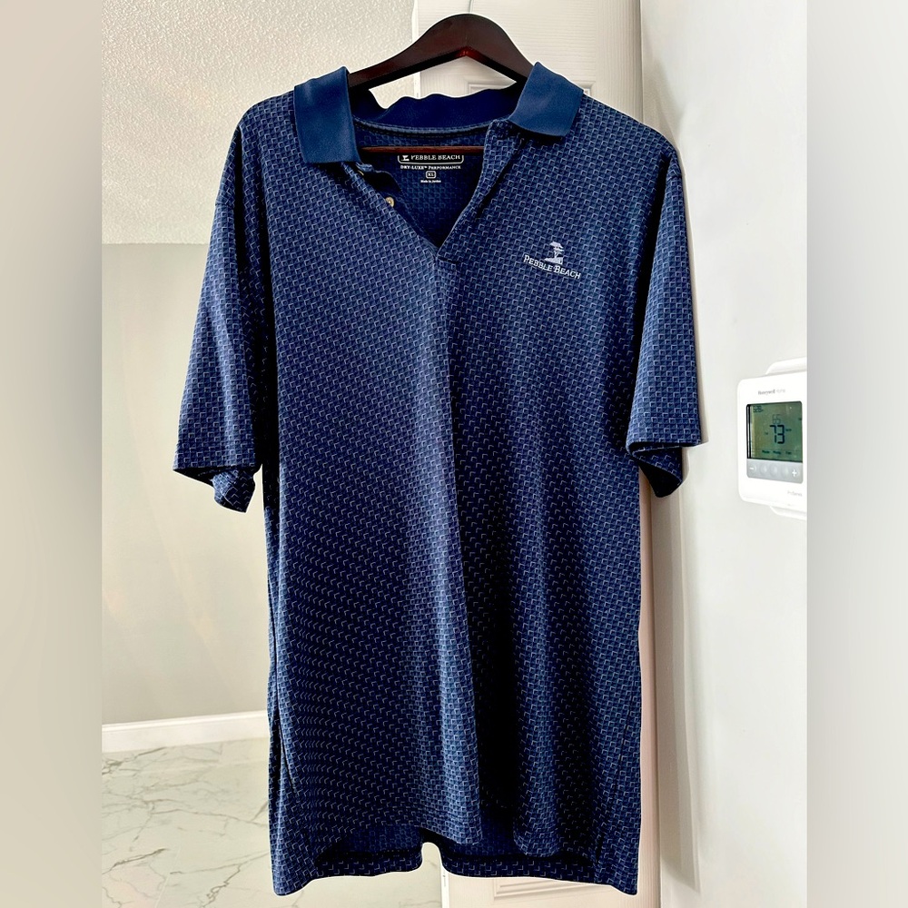 Brand new Blue short sleeve shirt with collar. Pebble beach logo golf shirt. XL